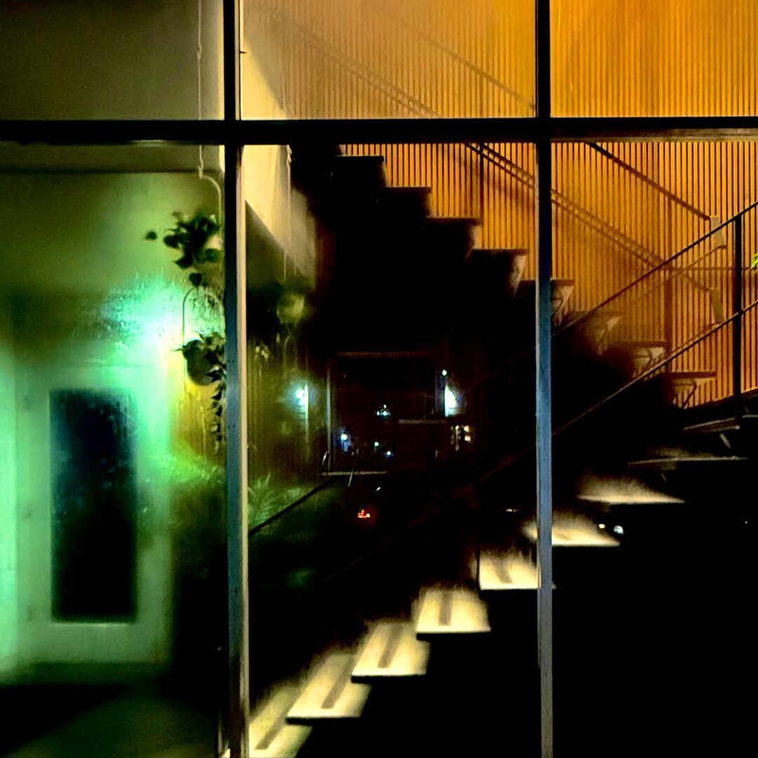 Large window to a mid-century commercial building, but it