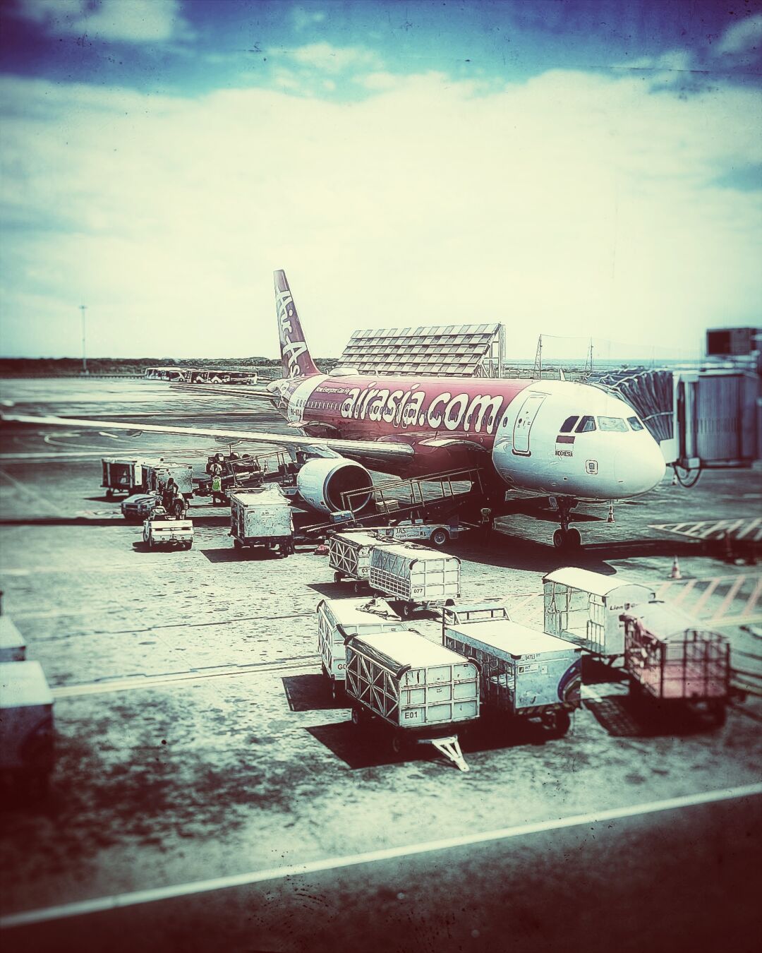 An airplane docked and waiting for passengers, at the airport in Tangerang, Indonesia.