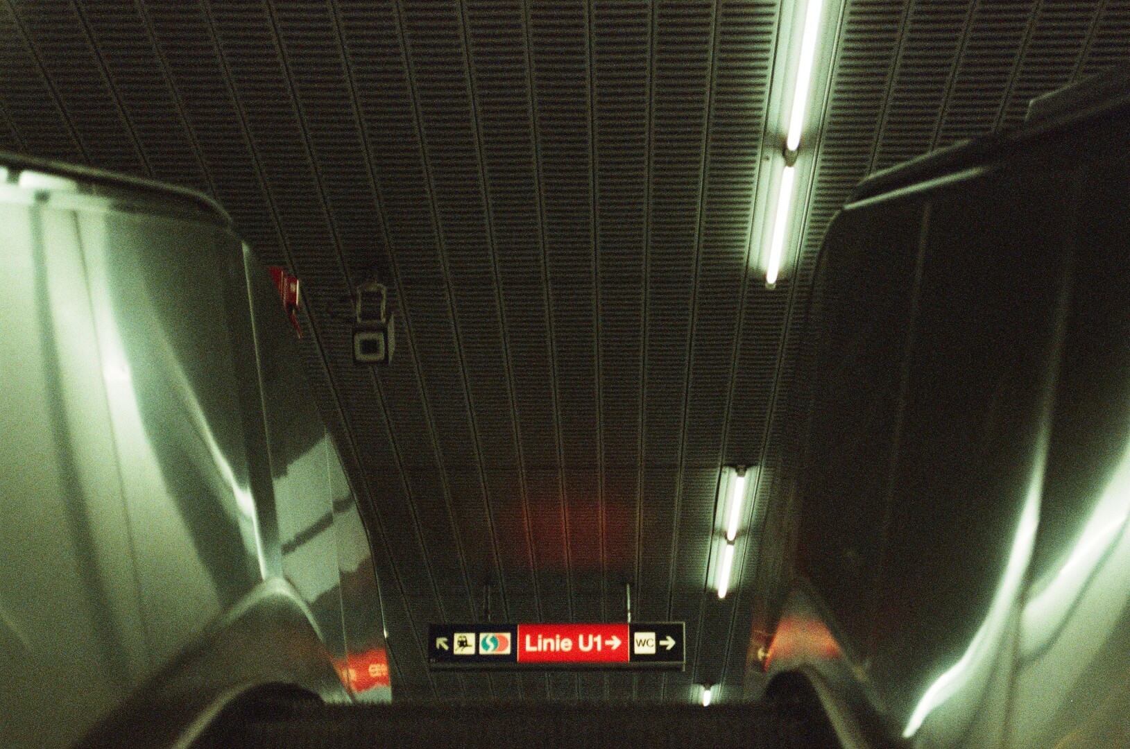 photo of a direction table in the metro taken from the escalator