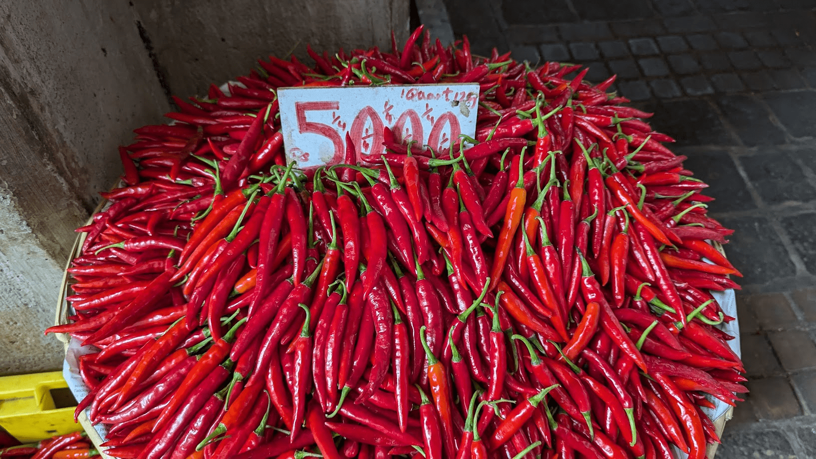 a basket full of hot peppers on the market a basket full of hot peppers on the market