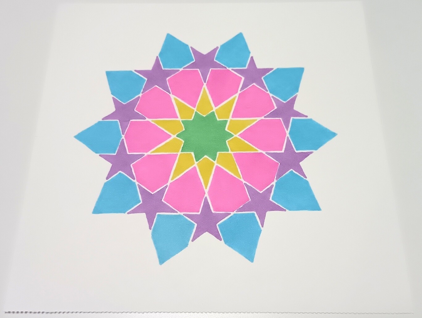 Drawing of a ten-pointed star with blue, purple, pink, yellow and green sections.