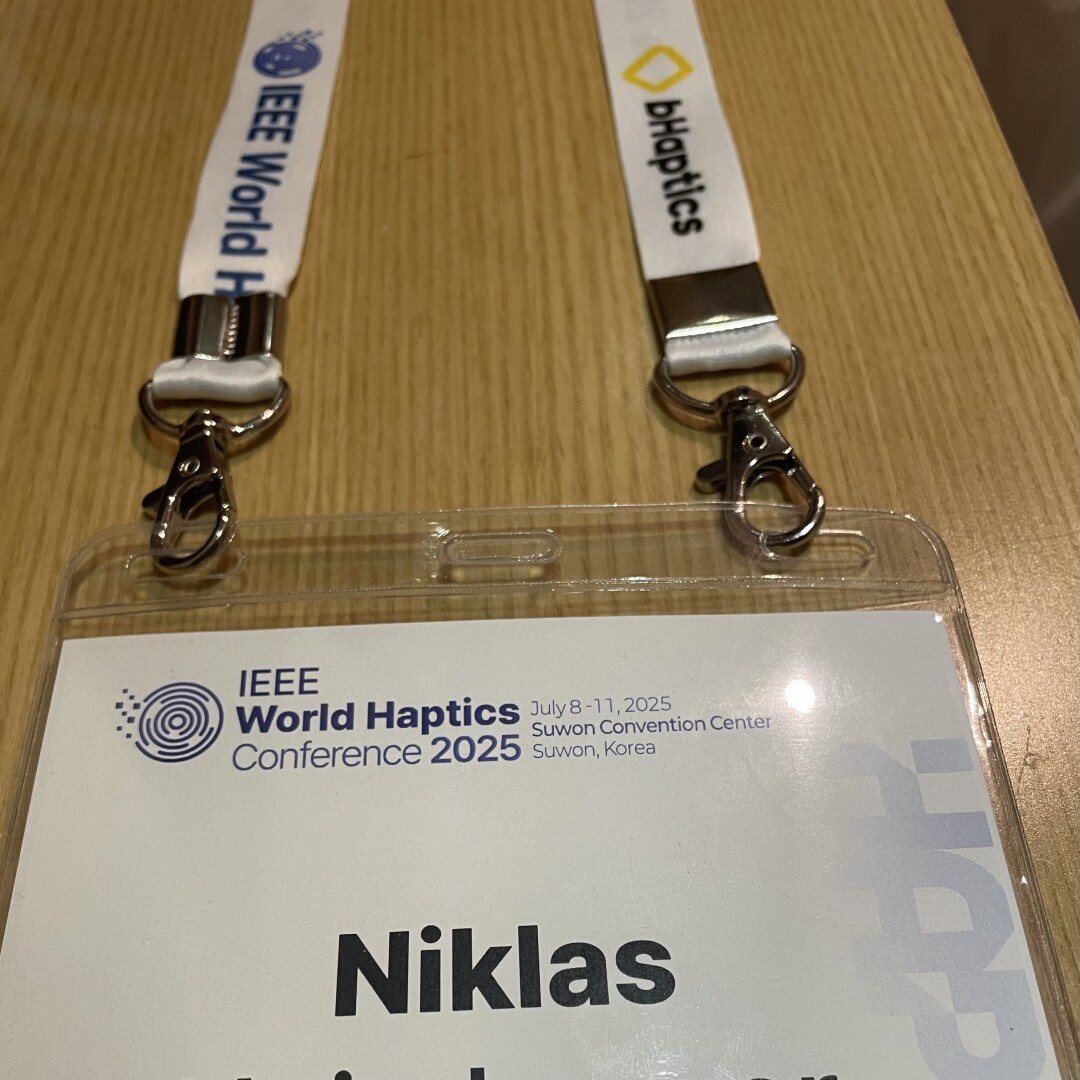 My name badge for the conference showing the World Haptics logo.