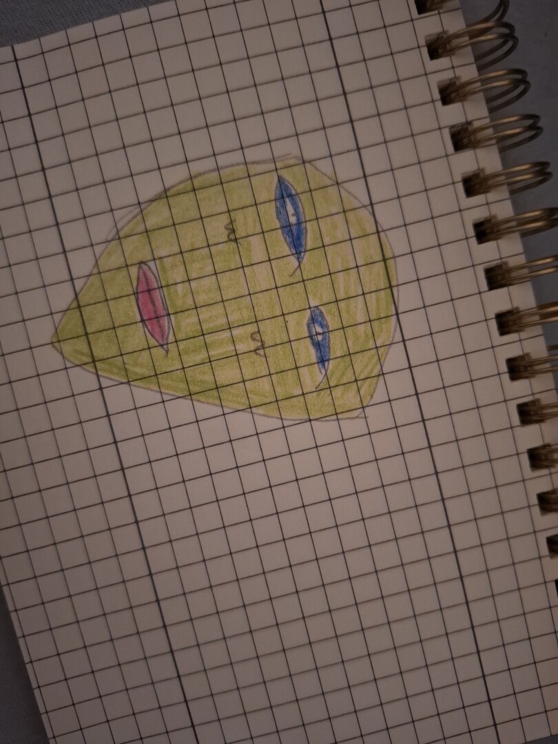 Drawing of a green alien head with red lips and blue eyes